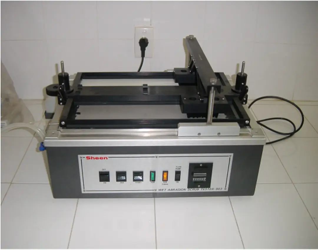 Hình 12.13.  Thiết bị xác định độ mài mòn của màng sơn Sheen Ref 903/2